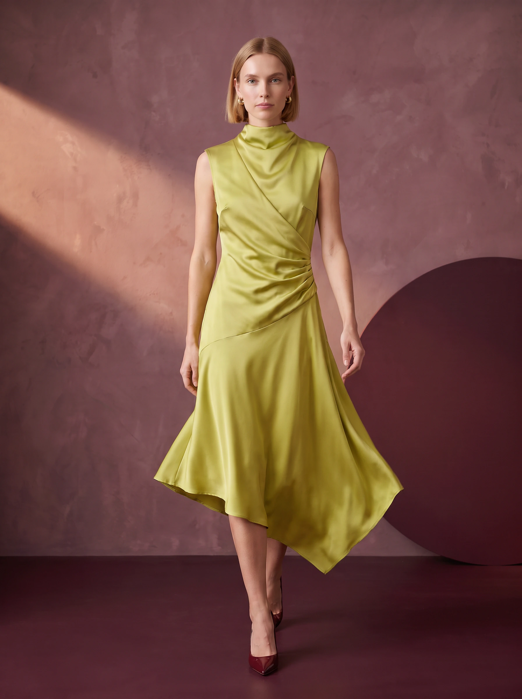Walking campaign concept: the same model wearing the pista satin midi dress in a plum studio