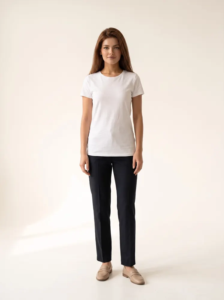 Amy, a fictional AI model: full length, with long chestnut hair, in a white tee and dark trousers