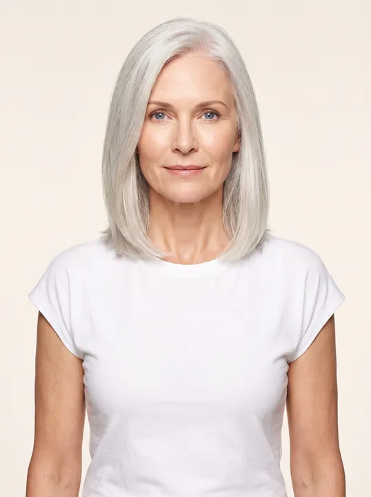 Ingrid, a fictional AI model: a woman with a sleek silver lob and blue eyes, in a white tee