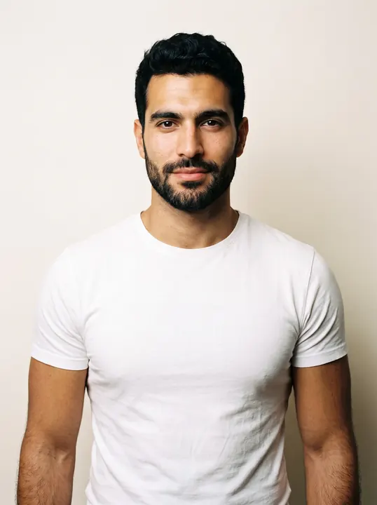 Karim, a fictional AI model: a man with short black hair, dark eyes and a trimmed beard, in a white tee