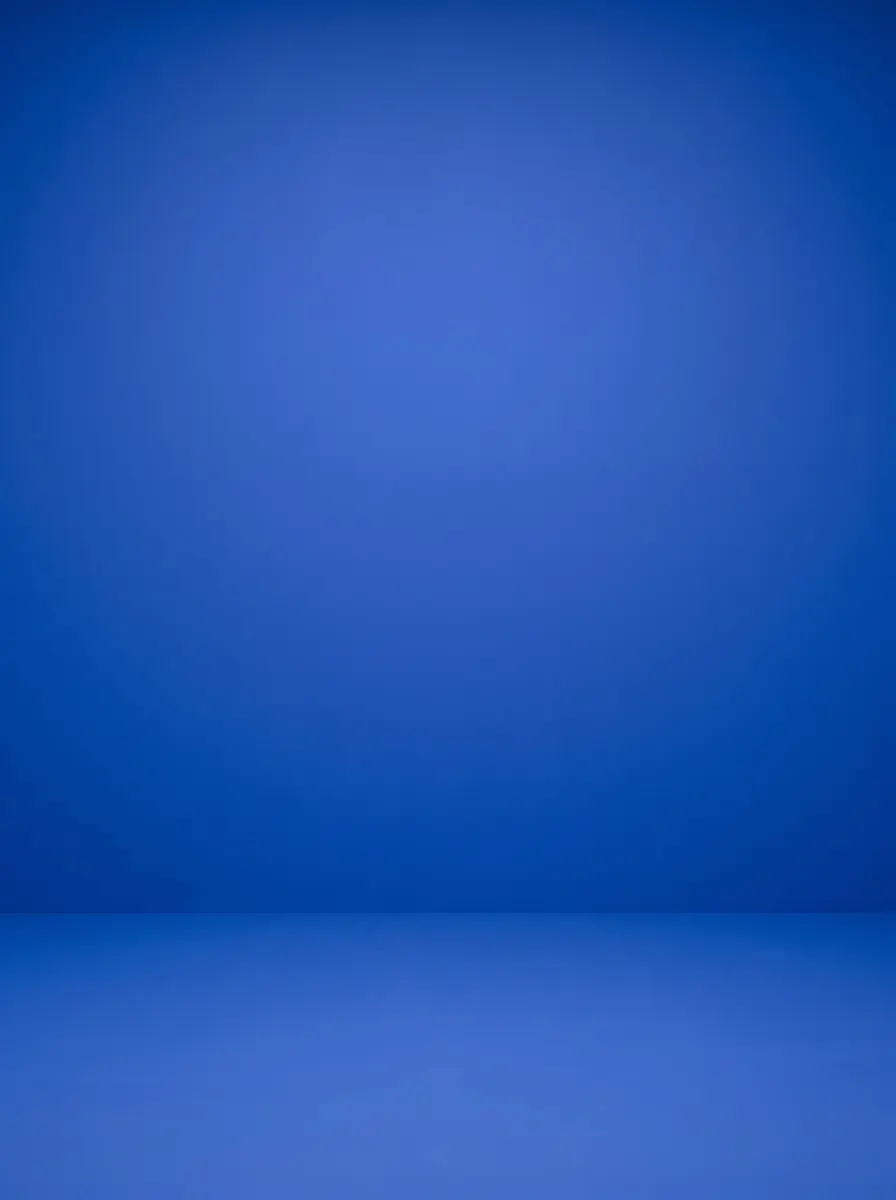 Saturated cobalt-blue backdrop and floor in crisp light