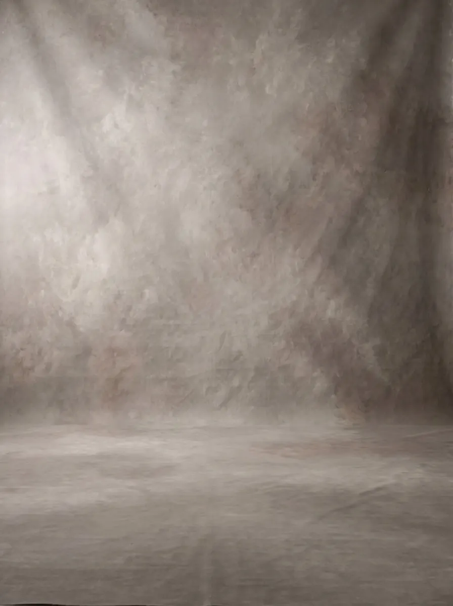 A hand-painted canvas backdrop mottled in warm stone and grey